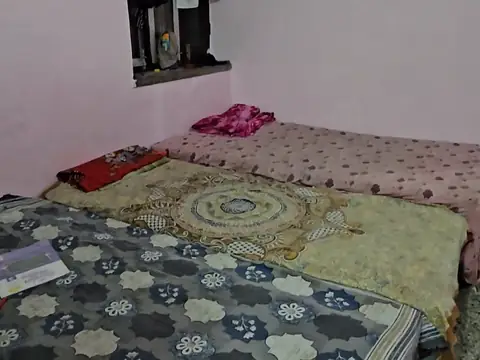 Furnished hostel room with beds