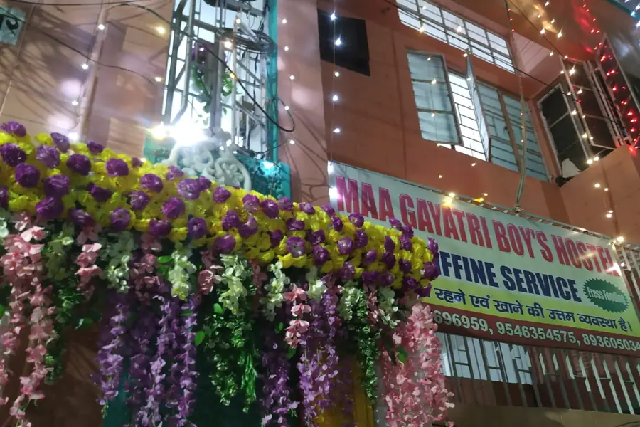 Hostel decorated with lights and flowers for a festival